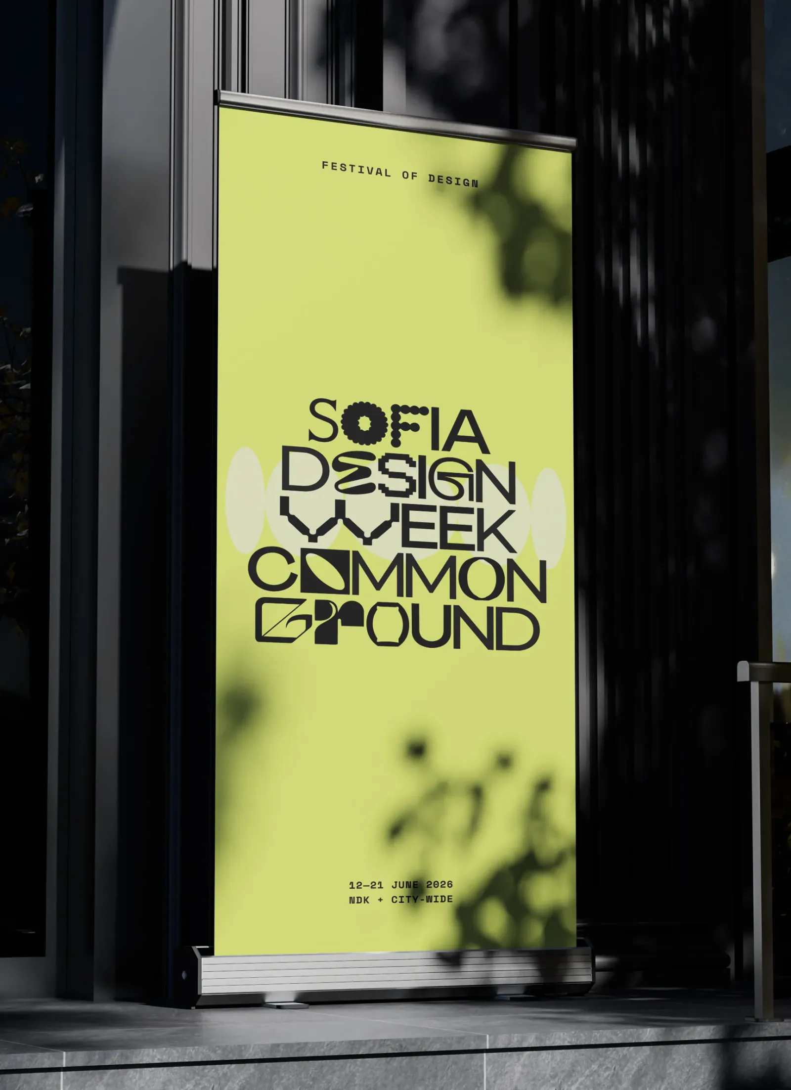 A Sofia Design Week poster on a street stand